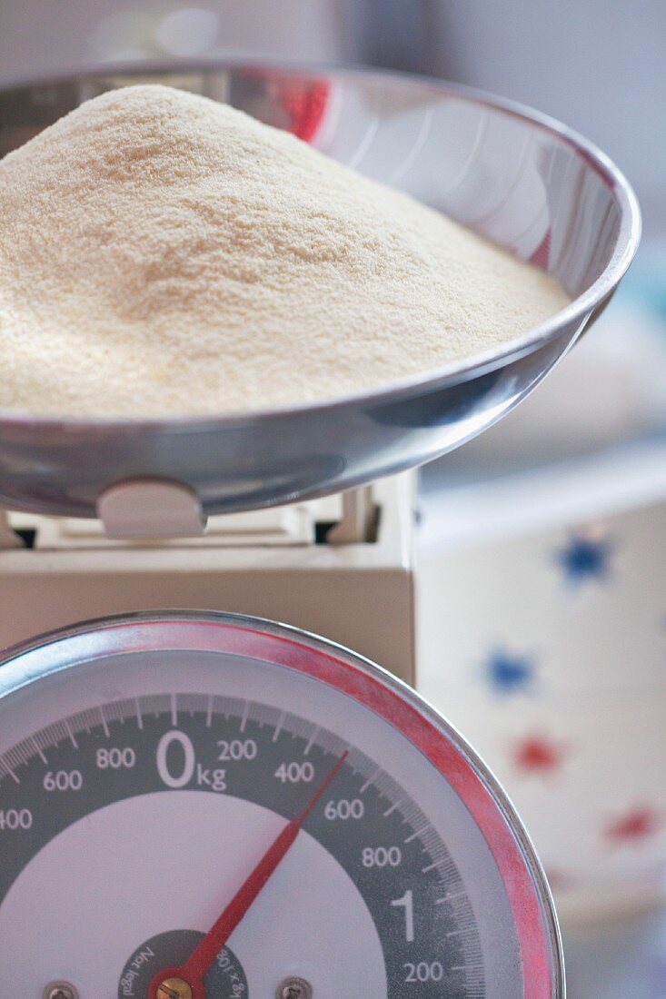 A mound of flour on a set of kitchen scales