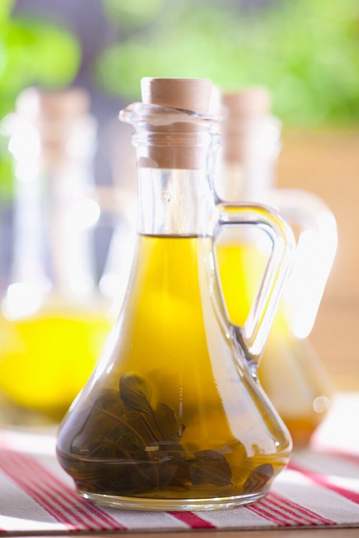 Olive oil with sage in a bottle
