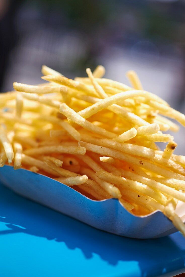 French fries in a cardboard dish