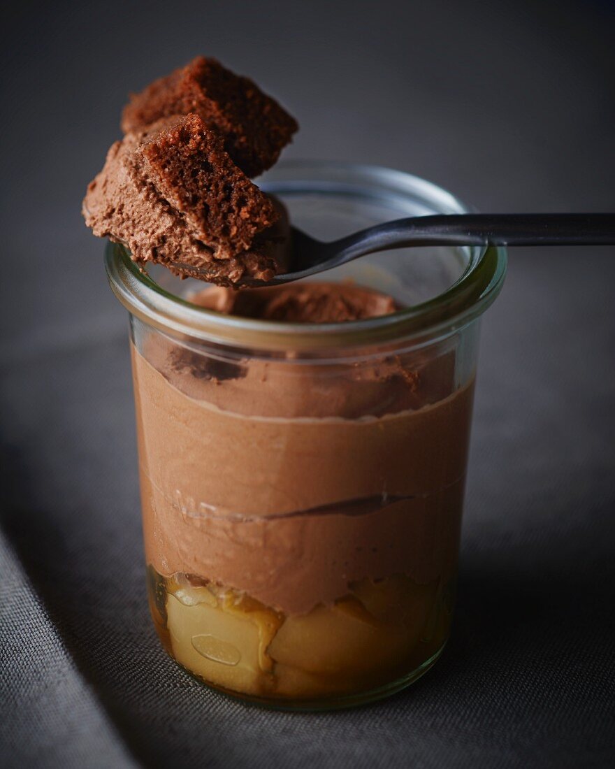 Mousse au chocolate with pears served in a jar