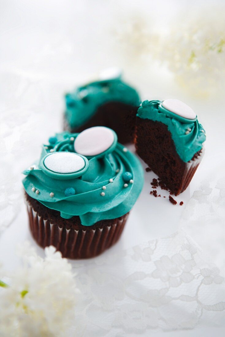 Chocolate cupcakes with petrol blue buttercream icing