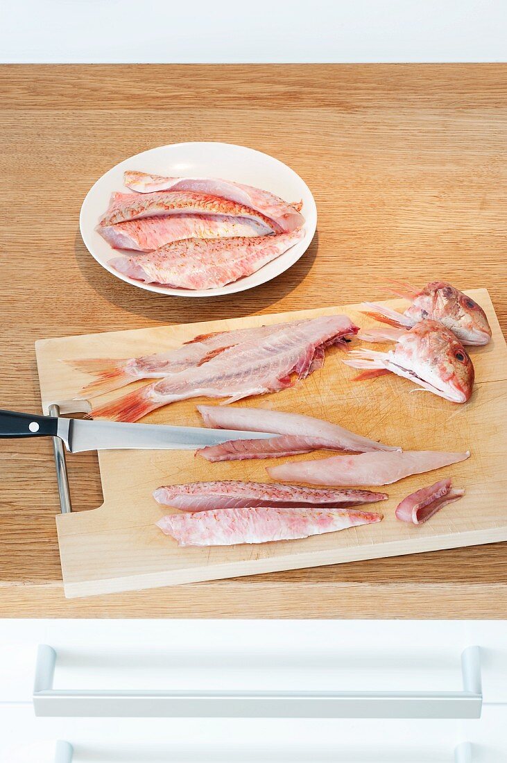 Filleted red mullet on the chopping board