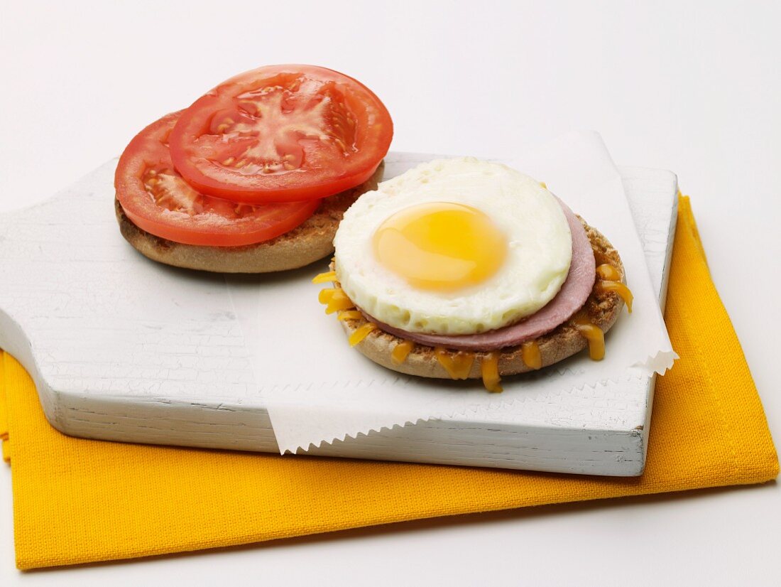 Open Ham and Egg Sandwich on an English Muffin with Tomato