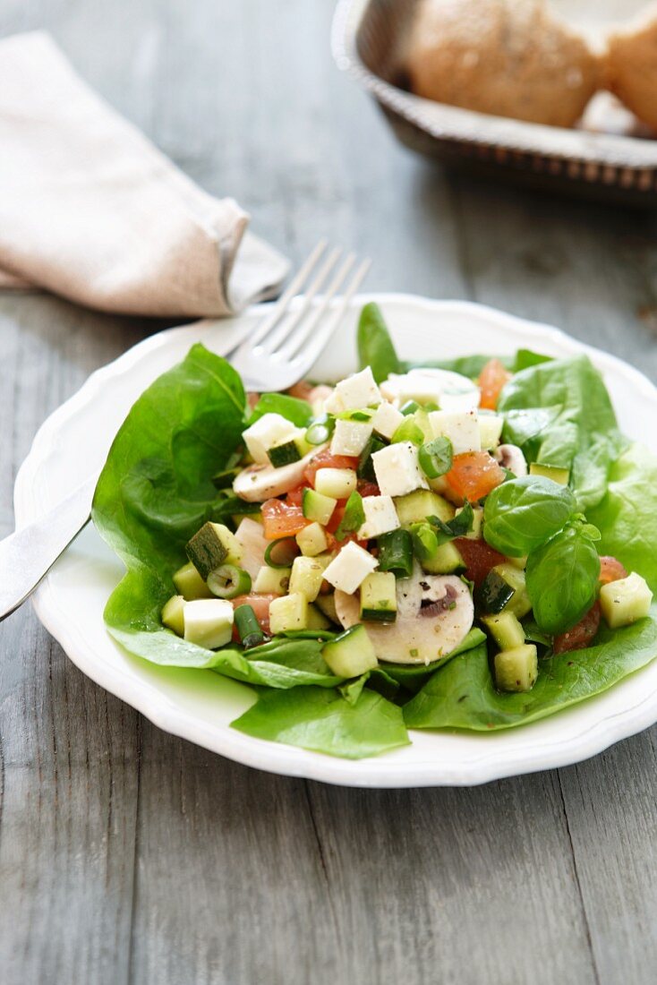 Courgette salad with cheese and sausage