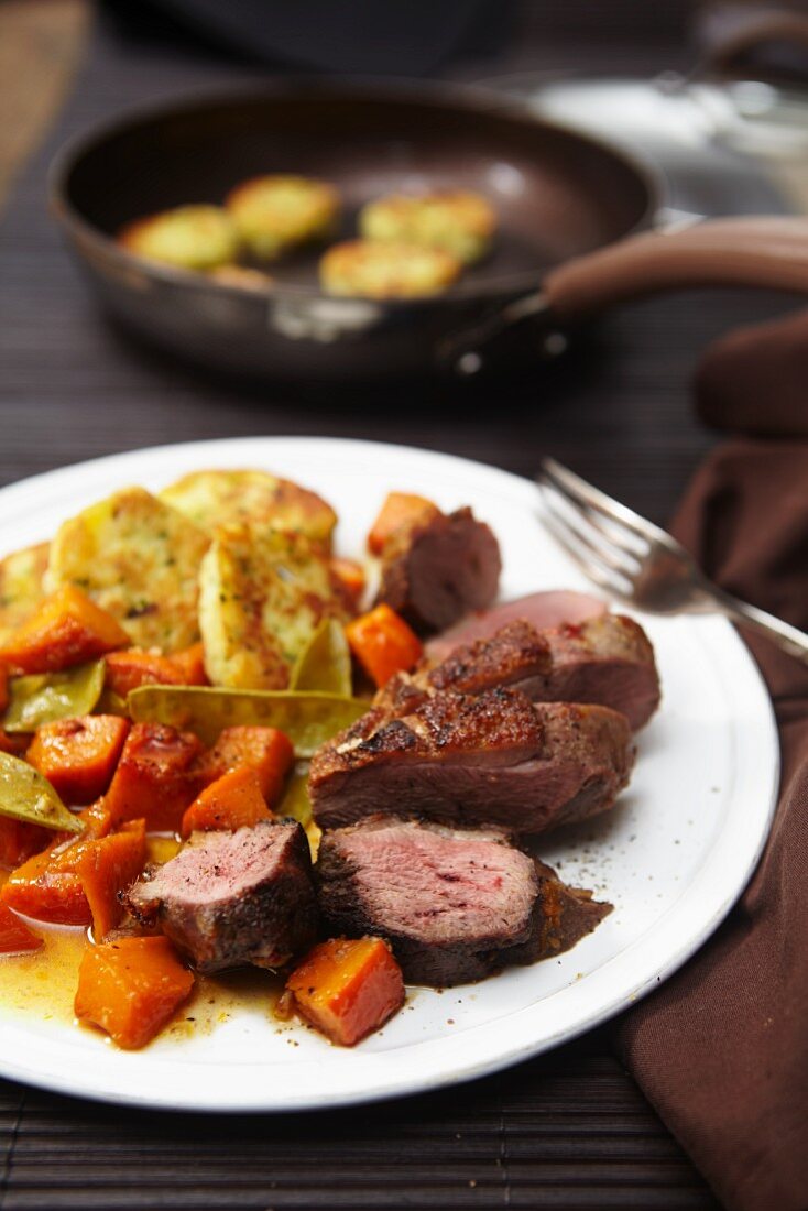 Goose breast with squash and potato fritters