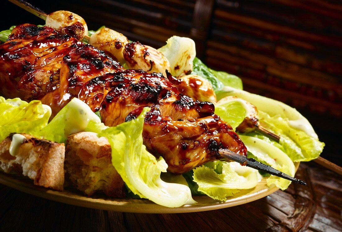 Grilled teriyaki chicken on Caesar salad