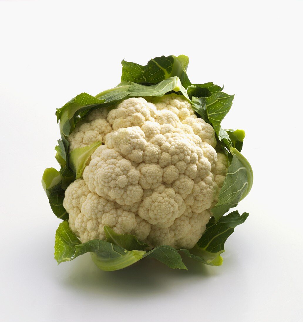 A cauliflower on a white surface