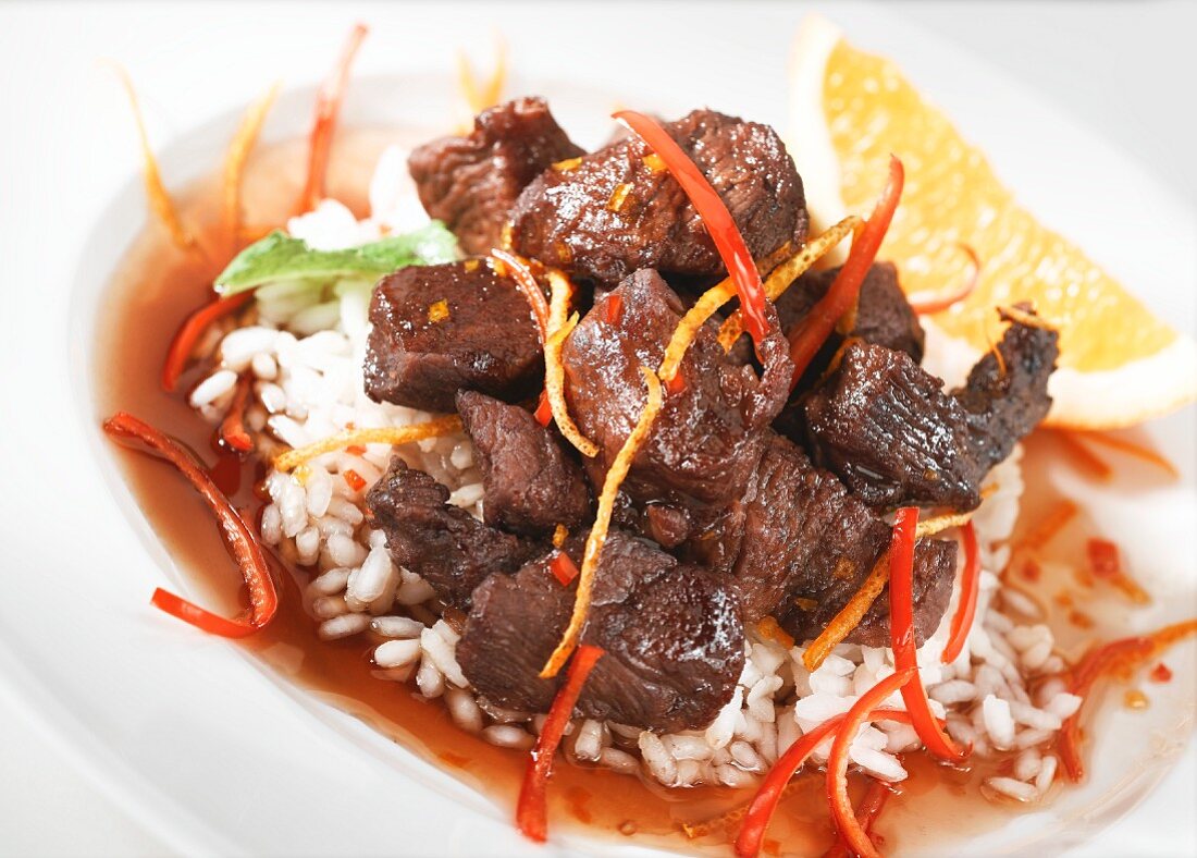 Beef ragout with orange sauce on a bed of rice