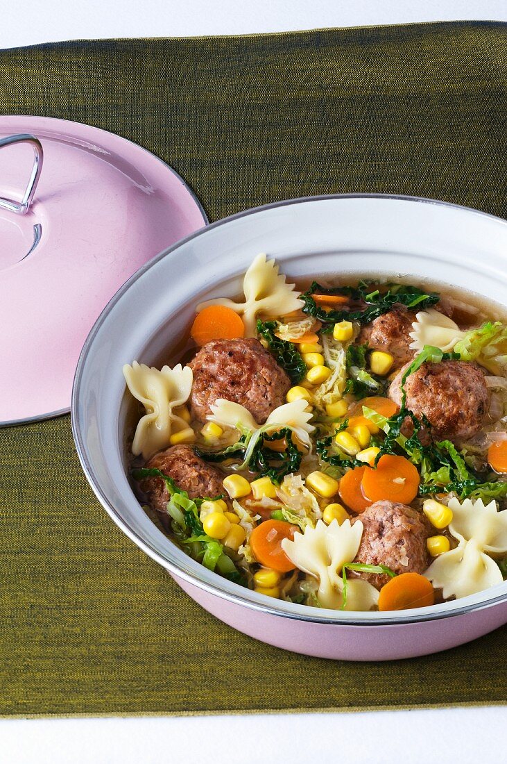 A stew of savoy cabbage, meatballs and farfalle