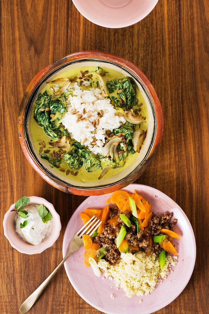 Spinach curry with rice; a couscous and minced meat dish with dip