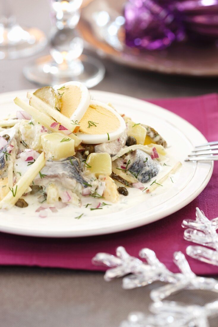 Herring salad with potatoes and eggs for Christmas