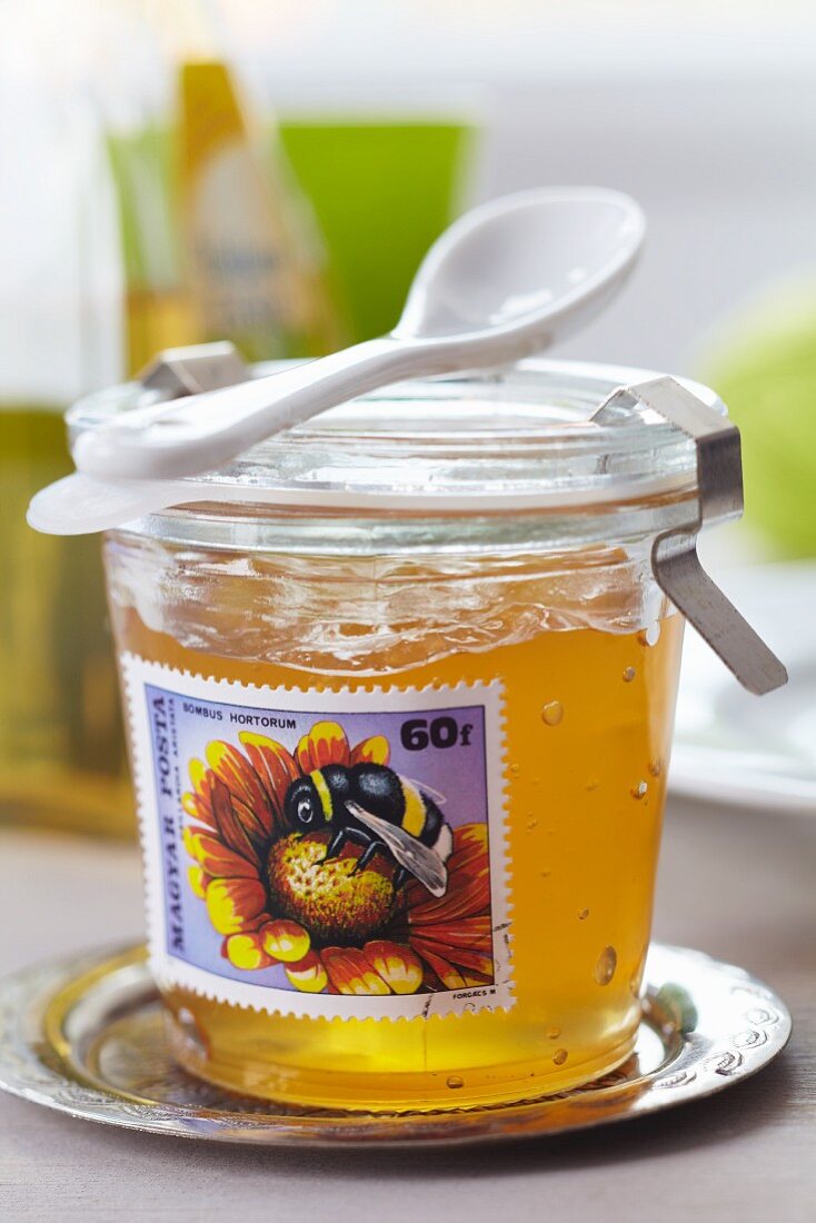 Jar of jam decorated with postage stamp