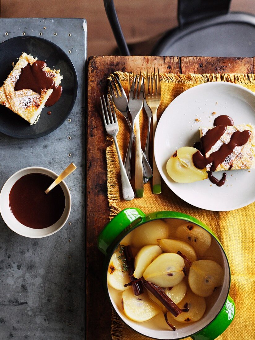 Ricotta cake with poached pears and chocolate sauce