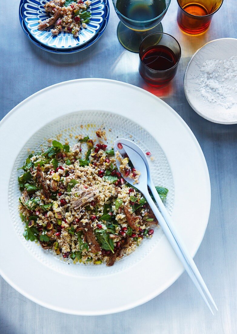 Bulgur salad with pomegranate, mint, pistachio and crispy pork