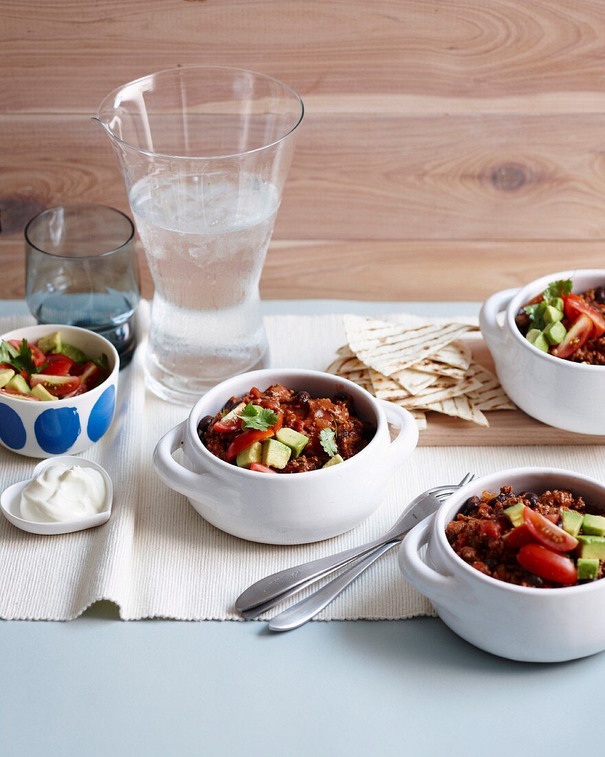 Beef and black bean chilli with avocado salsa