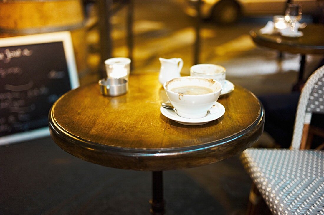 A table with coffee cups in a cafe (Paris, France)
