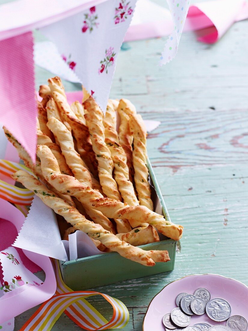 Twisted pastry sticks filled with Parmesan and spring onions