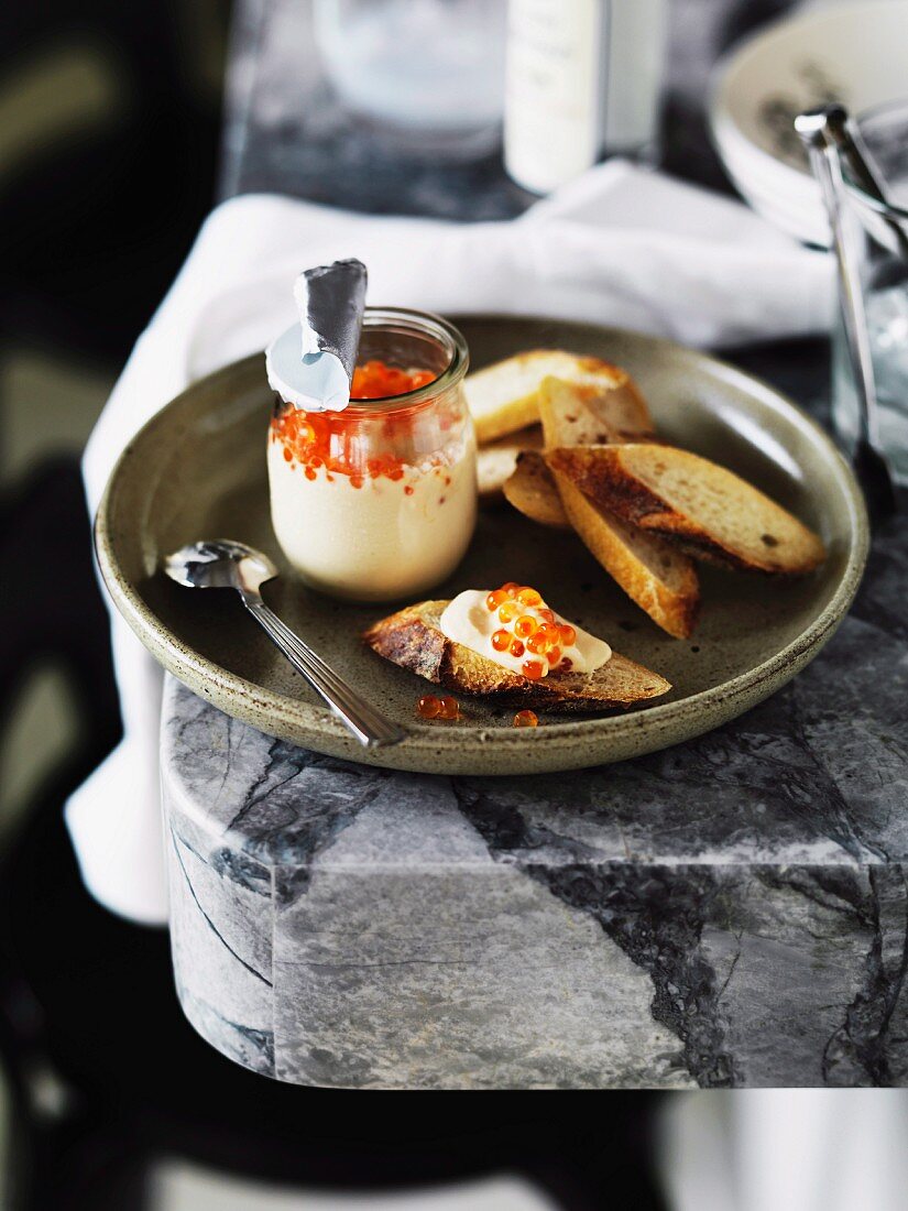 Taramasalata (fish roe cream) with salmon caviar and baguette slices