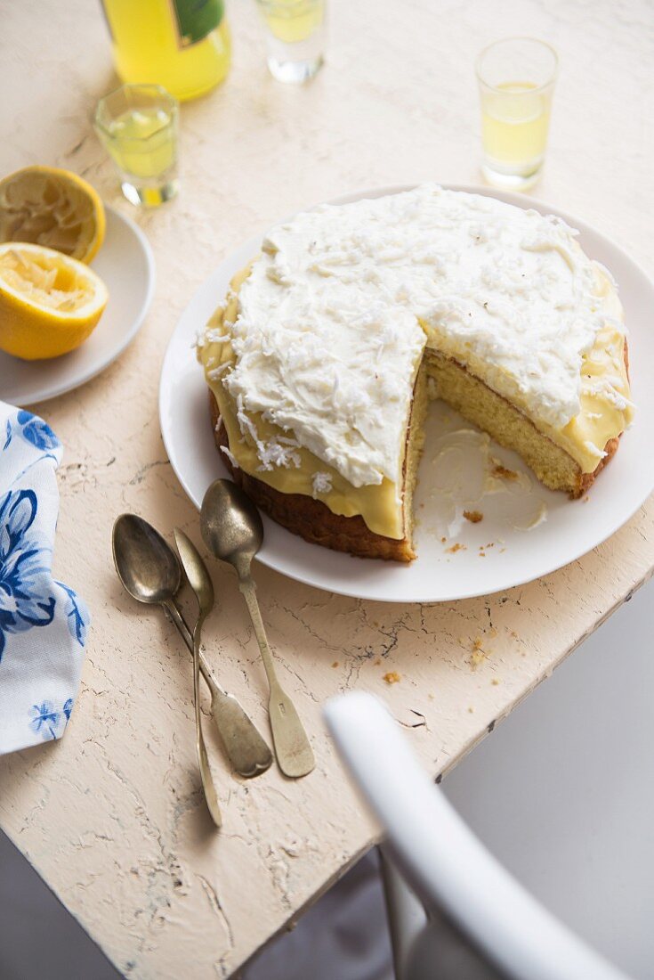 Lemon and coconut cake, partly sliced