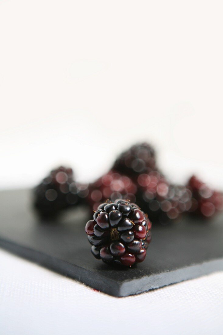 Blackberries on a black board