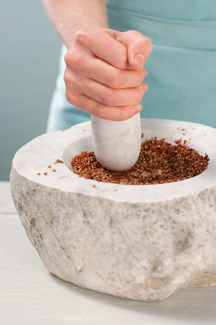 Spices being ground in a mortar