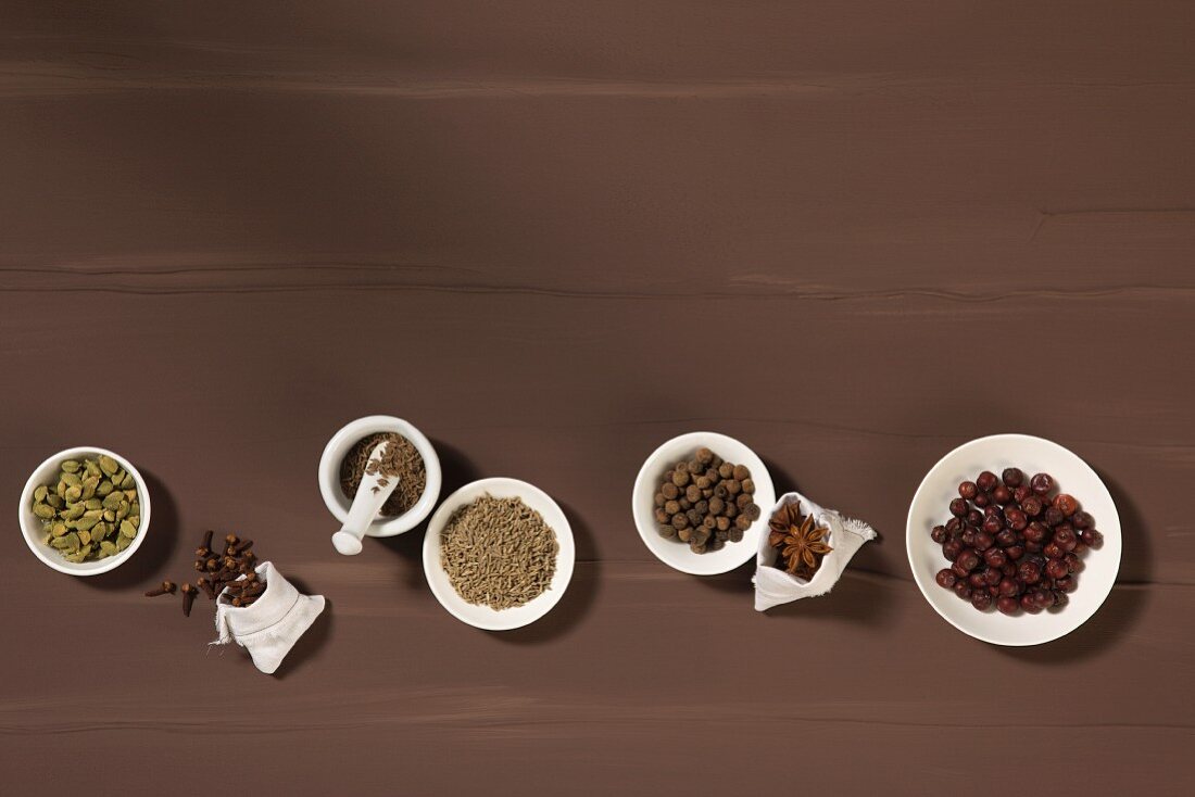 Assorted spices on wood