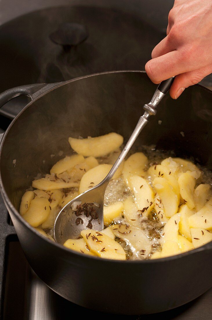 Potatoes being boiled with caraway