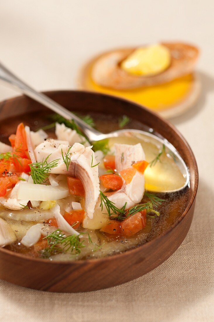 Trout soup with diced tomatoes