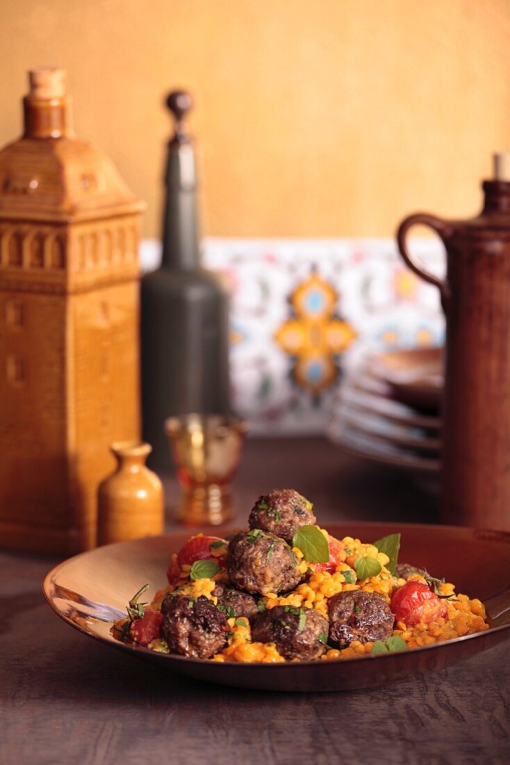 Koftas (Turkish meatballs) with a lentil and tomato medley
