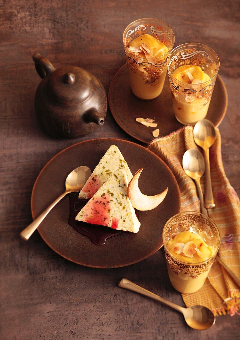 Turkish desserts: pistachio parfait with pomegranate syrup and almond pudding with saffron