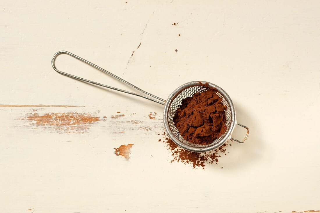 Cocoa powder in a sieve