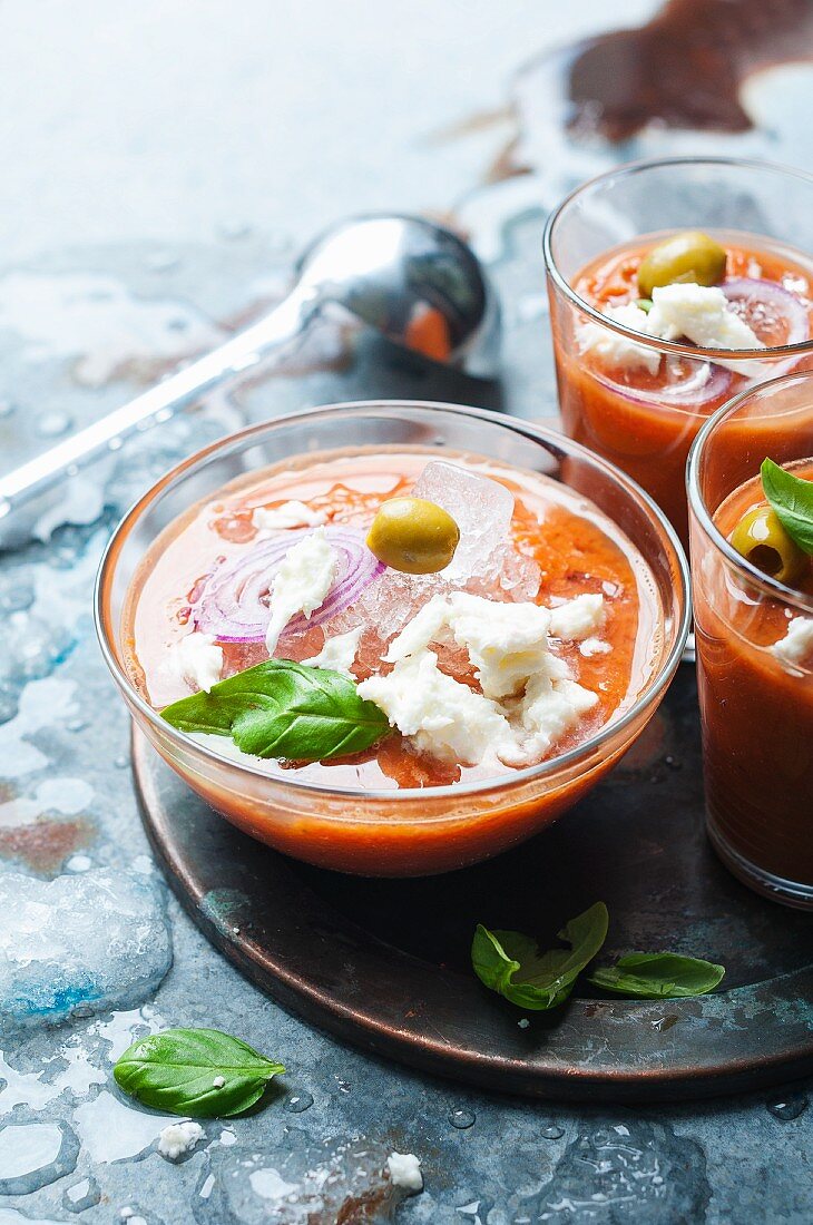 Cold tomato soup with mozzarella and olives
