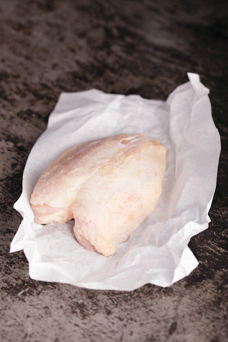 Chicken breast on baking parchment