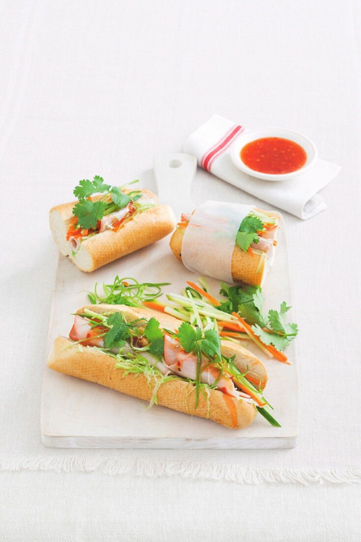 Baguette sandwiches with roast pork, julienne vegetables and coriander