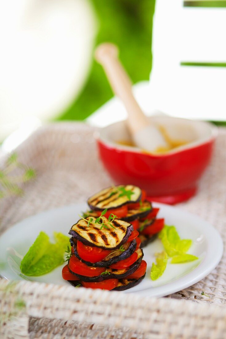 Vegetable stacks of grilled aubergine slices and tomatoes