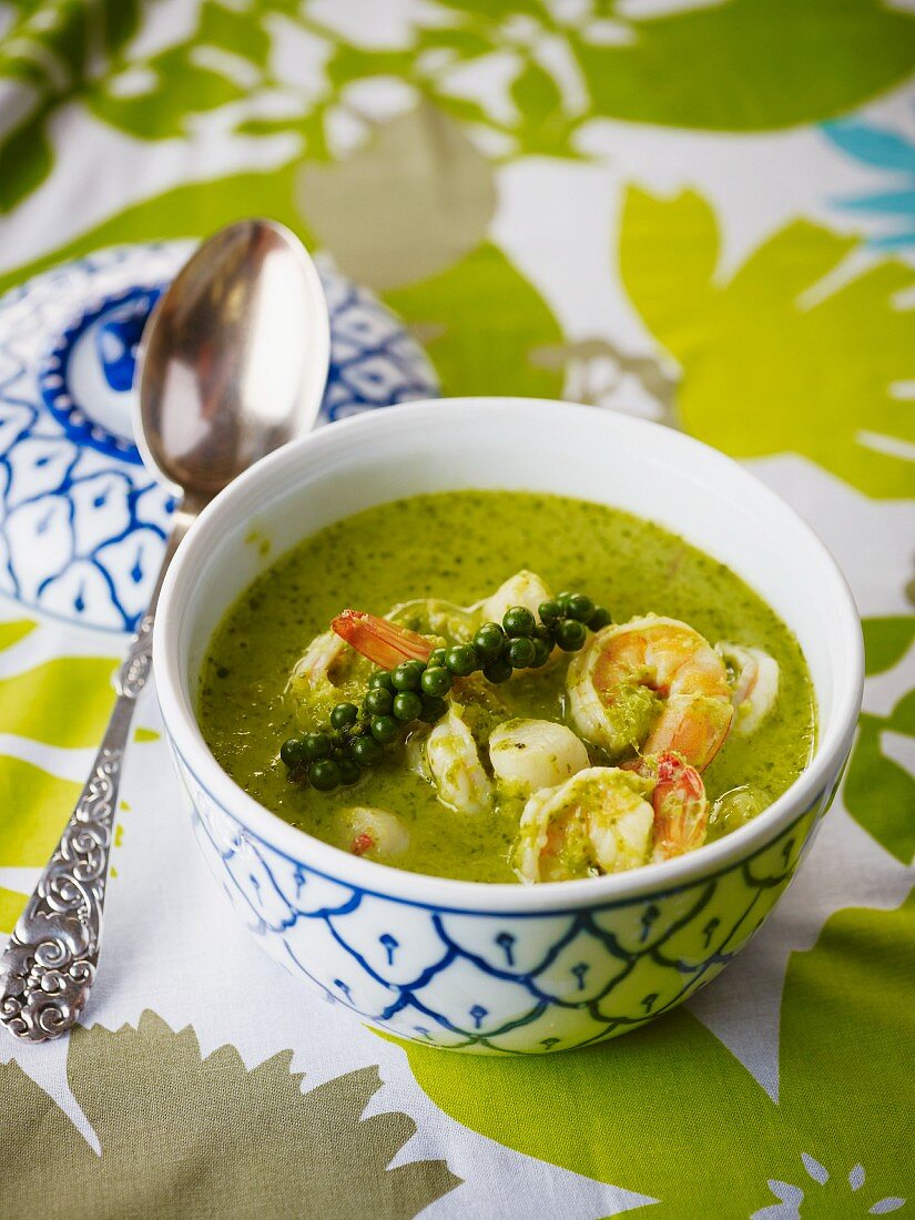 Green coconut milk soup with prawns, scallops and peppercorns