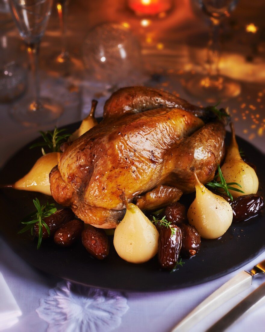 Roast guinea fowl with pears and dates