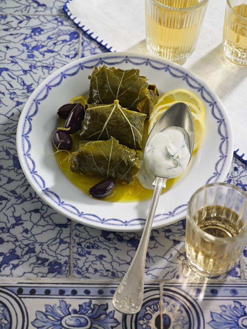 Stuffed vine leaves with black olives