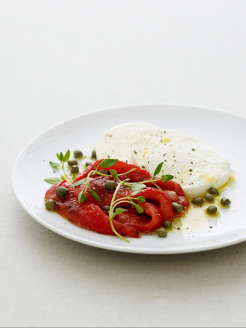 Grilled red pepper with sliced mozzarella, dressed with capers, oil and blackpepper
