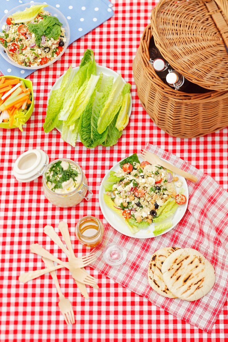 Bulgur salad with chickpeas and feta, romain lettuce and home-made hummus for picnic
