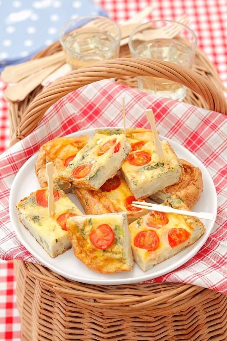 Potato tortilla with cherry tomatoes and green onion