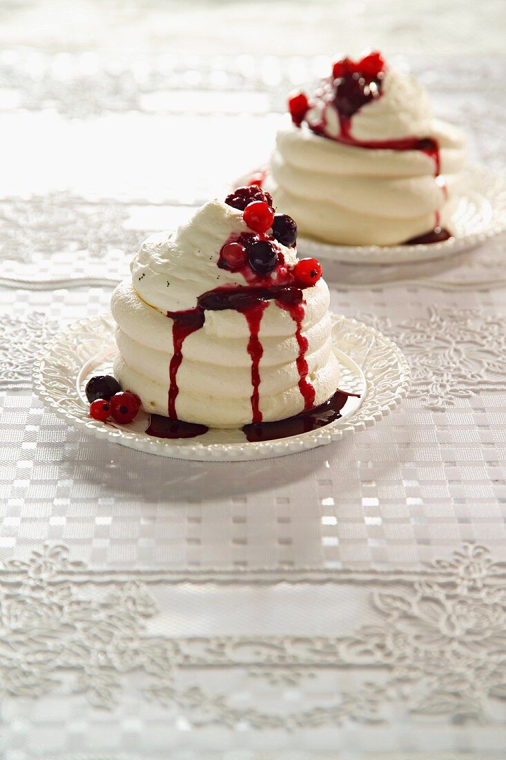 Individual meringue tortes with berry sauce