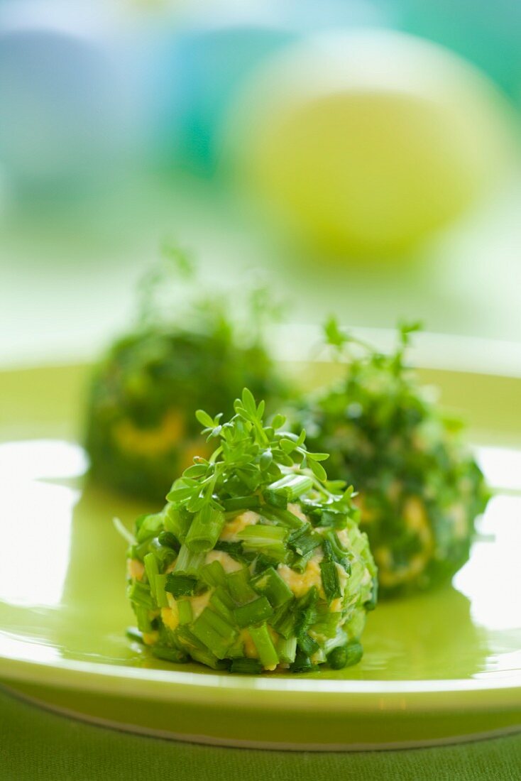 Balls of creamed egg coated in chives
