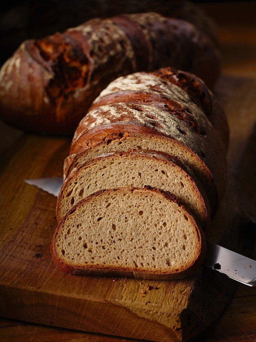 Farmhouse bread, partly sliced