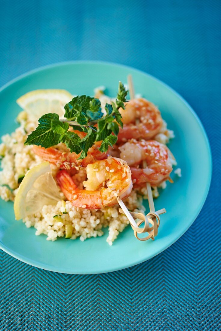 Prawn skewers on a bed of couscous