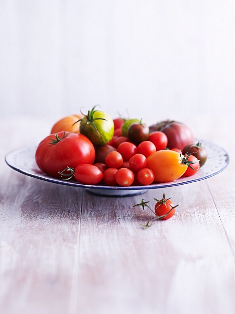 A variety of tomatoes on a plate