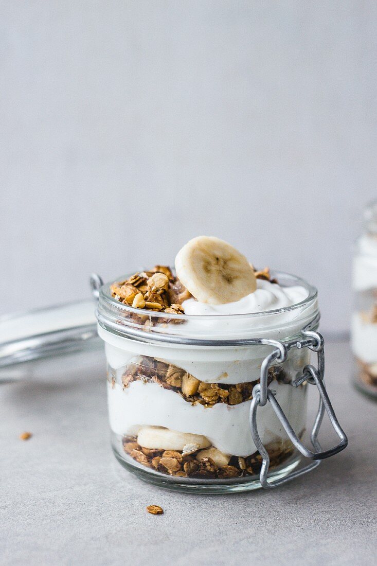 Cereal grains with yoghurt parfait and banana