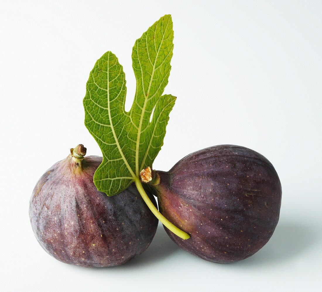 Two figs with a fig leaf