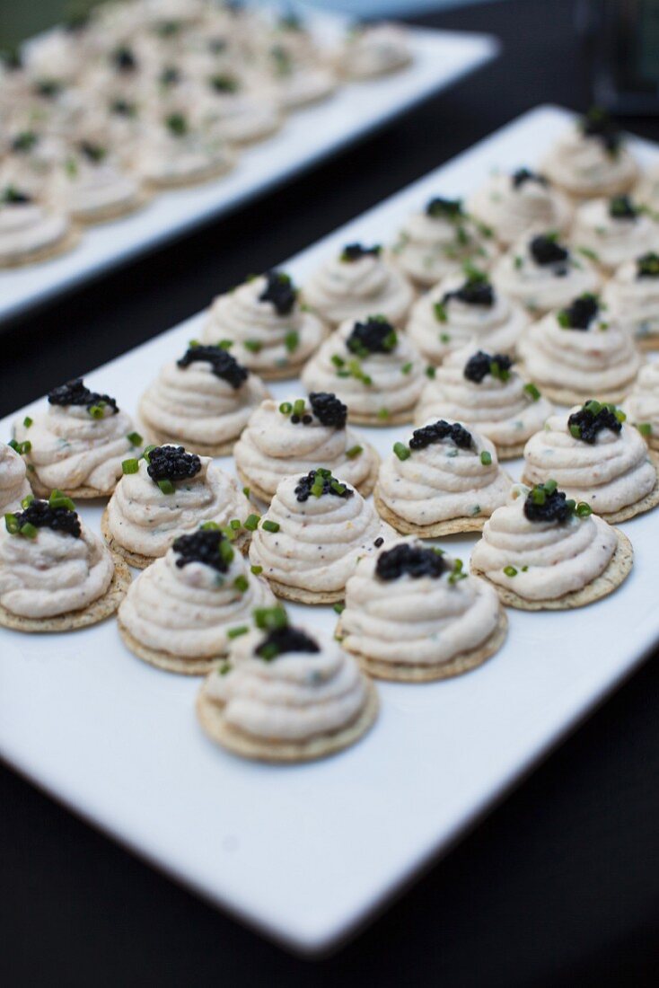 Crackers Topped with Smoked Trout Mousse and Caviar