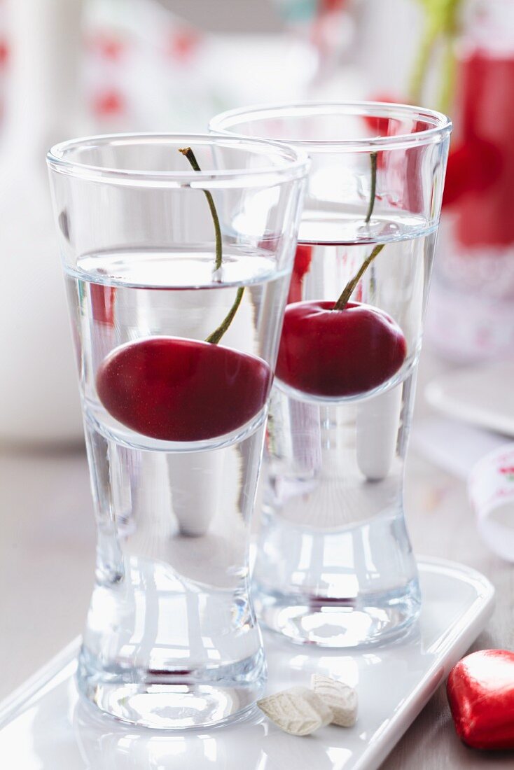 Cherry schnapps in shot glasses with cherries